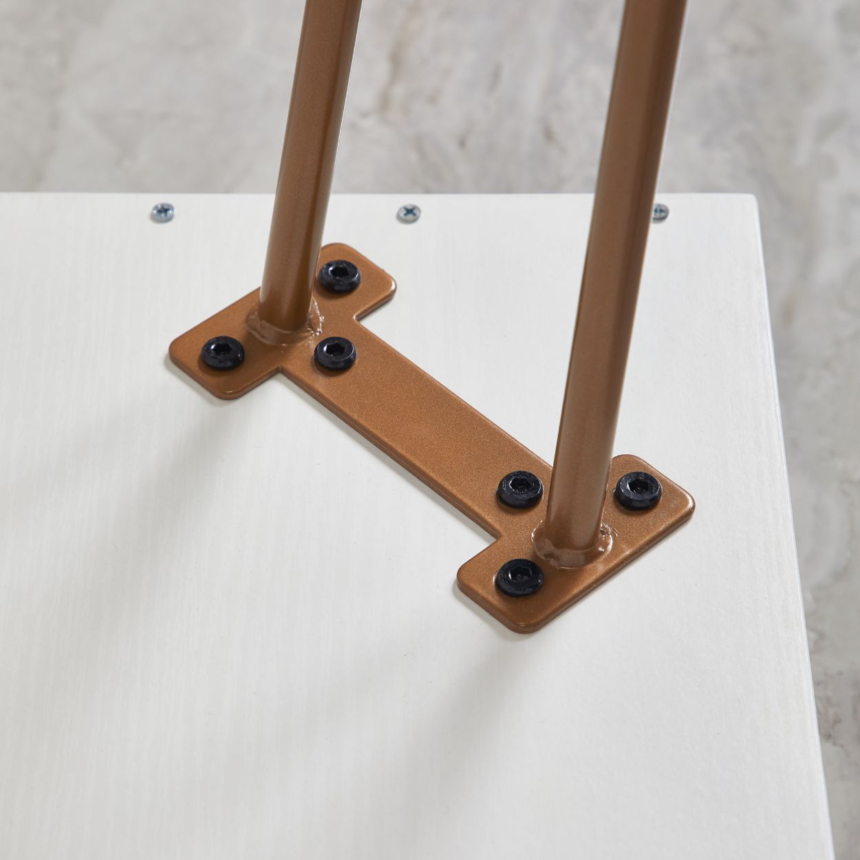 The desk legs can be easily attached to the bottom of the table, makes it very easy for assembly